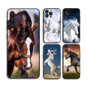May include: Set of five phone cases featuring different images of horses. The cases are black with a clear plastic window showing the image. The images include a brown horse, a white horse running, a white horse with a starry sky background, a white horse rearing up, and a black horse running through a field.