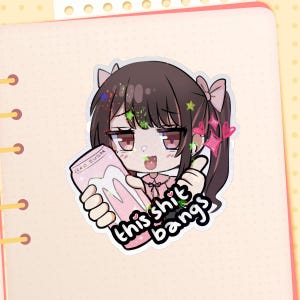 May include: A holographic sticker featuring an anime-style character with brown hair and pink bows. The character holds a pink package labeled "ZERO SUGAR" and the sticker reads "this shit bangs".