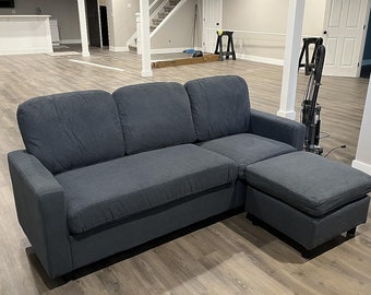 Black three-seat, L-shaped, upholstered sectional sofa, apartments, dorm rooms, and bonus rooms