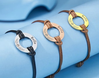 Pulsera conmemorativa para mascotas con alas de ángel grabadas a medida, diseño de cuerda de cuero sintético con dije de huella de pata, un regalo de recuerdo considerado para los amantes de las mascotas.