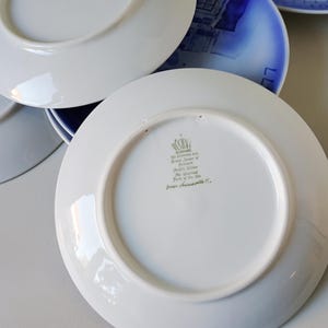 May include: White ceramic plate with a green and gold inscription that reads "The Unicorn, Prince of the Sea, from Franciscan Pottery Co."