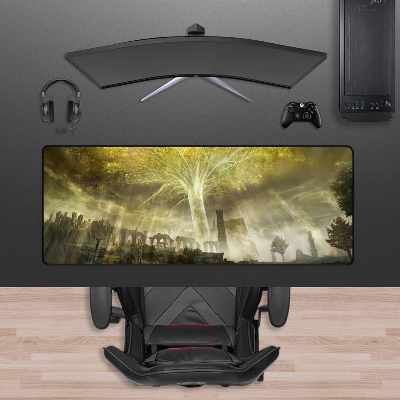 May include: A gaming setup featuring a curved monitor, headset, controller, and a computer tower. A large rectangular mousepad displays a fantasy landscape with a large tree. A black gaming chair is at the bottom of the image.