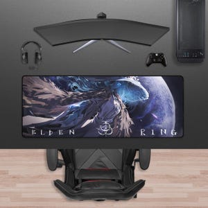 May include: A gaming setup featuring a curved monitor, headset, and a mousepad with "ELDEN RING" text and a fantasy art design. A black gaming chair and computer tower are also visible.