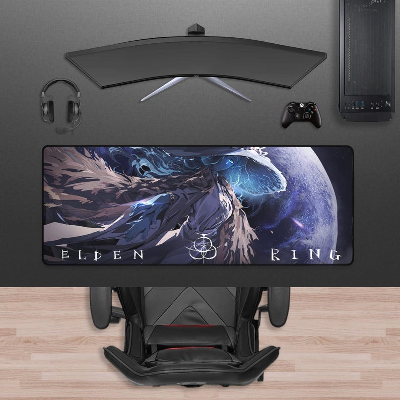 May include: A gaming setup featuring a curved monitor, headset, and a mousepad with "ELDEN RING" text and a fantasy art design. A black gaming chair and computer tower are also visible.