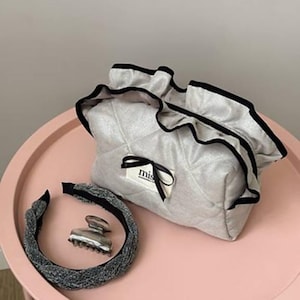 Gray Suede Ruffle Makeup Bag: Elegant Travel Cosmetic Pouch