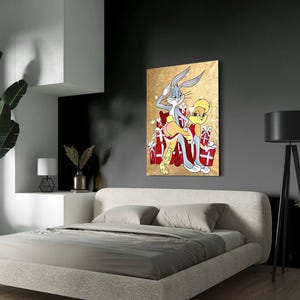 May include: A painting of Bugs Bunny and Lola Bunny in a playful pose, surrounded by red and white gift boxes. The background is a gold metallic color.