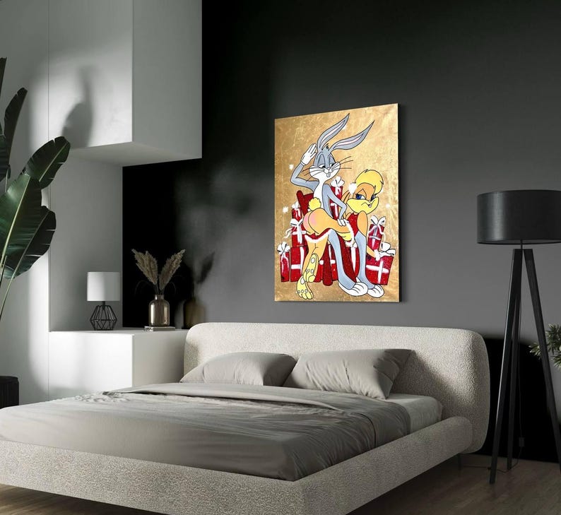 May include: A painting of Bugs Bunny and Lola Bunny in a playful pose, surrounded by red and white gift boxes. The background is a gold metallic color.
