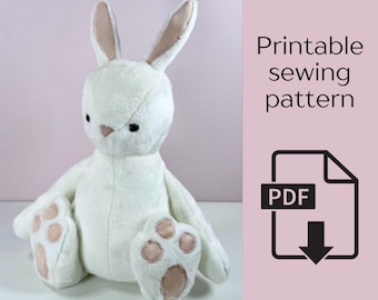 May include: A plush white bunny with long ears and a pink nose and paw pads. The bunny is sitting with its arms and legs outstretched. Text on the right says "Printable sewing pattern" with a PDF icon.