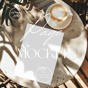 May include: A white sheet of paper with the text "Page Mockup" on a wooden table with a cup of coffee and a plant in the background.