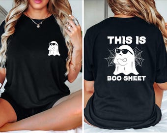 May include: Black t-shirt with a white ghost wearing sunglasses and the text "This is Boo Sheet" printed on the back. The front of the shirt has a smaller white ghost wearing sunglasses.