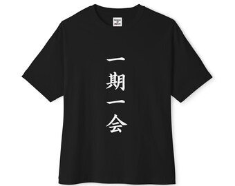 May include: Black t-shirt featuring white Japanese characters printed vertically. The top has a crew neck and short sleeves. A small white label is visible at the top of the shirt.