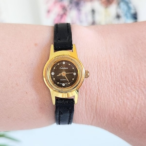 Womens Dainty Gold-Tone Wristwatch Crystal Diamond Rhinestone Accents Genuine Black Leather Strap Sleek Ladies Canteen Watch-Classy & Simple