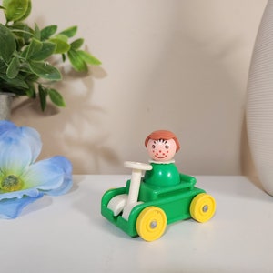 Vintage Fisher Price Little People - Little Riders Green Car with Green Body Dress Girl Figure / Character (orange freckles)