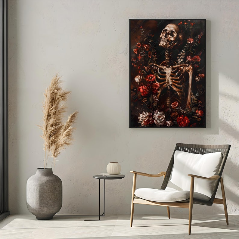 May include: A black framed print of a human skeleton surrounded by red and white flowers. The skeleton is posed with its head tilted back and its arms outstretched. The background is dark and the flowers are in sharp focus.