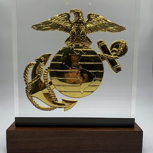 Military Retirement Gift or Promotion Award in clear Ballistic Glass with clear background.  USMC EGA Extra Large Gold Emblem.