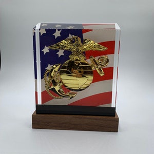 Military Retirement Gift or Promotion Award in clear Ballistic Glass with US Flag background.  USMC  Medium Gold EGA Emblem.