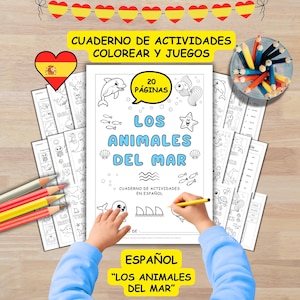 May include: A coloring book titled "Los Animales Del Mar" in Spanish, featuring sea animal illustrations. The cover displays the title, a dolphin, fish, and star. The book has 20 pages and is accompanied by colored pencils and bookmarks.