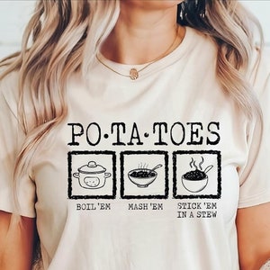 May include: A white t-shirt with a black graphic that says "PO-TA-TOES" and shows three different ways to prepare potatoes: boil, mash, and stick in a stew.