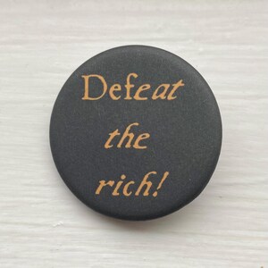 soft velvety matte activism button pin ~ 1.25 inch round, black & ochre ~ eco-friendly recycled metal pinback button