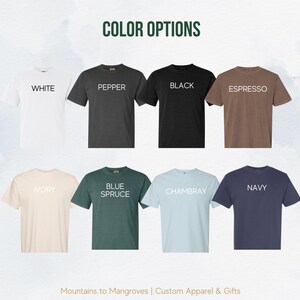 May include: A color chart showing different t-shirt colors. The colors are: White, Pepper, Black, Espresso, Ivory, Blue Spruce, Chambray, and Navy.