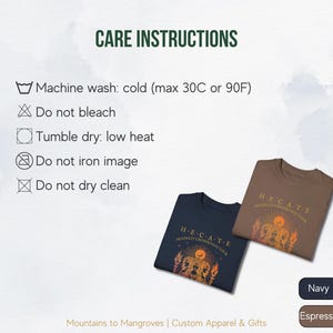May include: Two t-shirts with a graphic print of a woman's face with flames and the text "H-E-CATE MOONLIT CROSSROADS TOUR". The t-shirts are available in navy and espresso colors. Care instructions are listed on the left side of the image. Machine wash cold, tumble dry low heat, do not bleach, iron, or dry clean.
