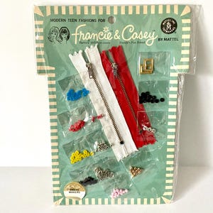 May include: Vintage sewing kit for "Francie & Casey" by Mattel, featuring a white and red zipper, various beads, and a gold buckle. The packaging is green with text that reads "Modern Teen Fashions".