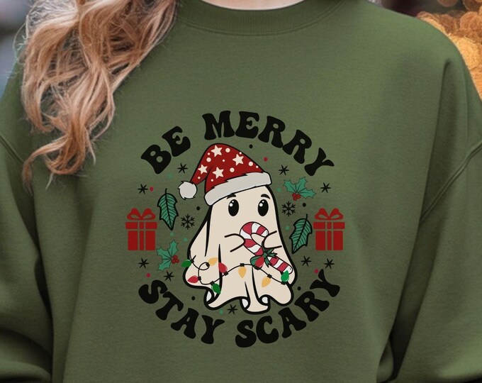 Be Merry, Stay Scary, Christmas sweatshirt, holiday ghost shirt, cute design, festive hoodie, quirky outfit, unique gift, fun winter apparel