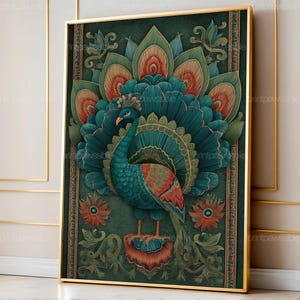 May include: A framed peacock art print. The peacock is depicted with teal and orange feathers, set against a dark green background. The artwork features floral and ornamental details, framed in a gold border. The print is displayed against a neutral wall.