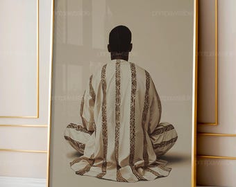 May include: A framed print showing a person in traditional clothing, seen from behind. The person is seated cross-legged, wearing a cream-coloured garment with vertical brown stripes. The artwork is set against a neutral background.