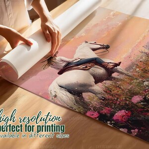 May include: A rolled canvas print depicting a white horse and rider amidst a floral landscape. The artwork uses a warm colour palette of pinks, oranges, and greens. Text on the print reads "high resolution" and "available in different sizes."