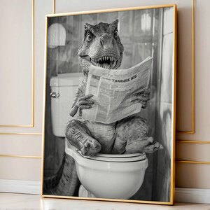 May include: A black and white photograph of a dinosaur sitting on a toilet and reading a newspaper. The dinosaur is wearing a serious expression and has its mouth slightly open. The newspaper is titled "Tanrase News".