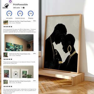 May include: A framed art print featuring a black and gold silhouette of a couple embracing. The artwork is displayed on a wooden shelf. The print has a light background and a dark wooden frame. The image is from the PrintPawssible Etsy shop.