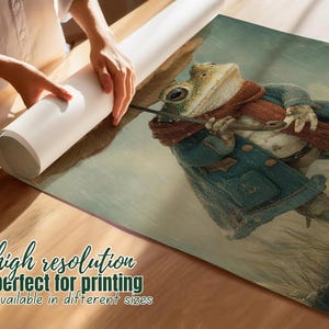 May include: A whimsical illustration of a frog dressed in a blue coat and a red scarf, holding a cane. The artwork is on a rolled-up print, with text at the bottom that reads "high resolution perfect for printing available in different sizes."