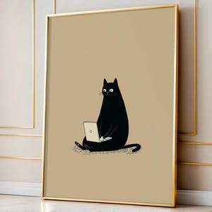 May include: A framed art print featuring a cartoon black cat sitting and using a laptop. The cat is depicted with a minimalist style against a tan background. The frame is gold.