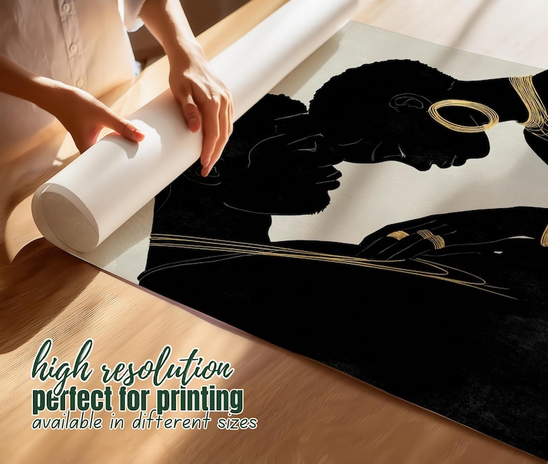 May include: A black and gold art print featuring two silhouetted figures in an embrace. The print has gold jewelry accents and is being unrolled. Text on the print reads "high resolution" and "available in different sizes".