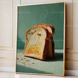 Może przedstawiać: Oprawiony wydruk artystyczny przedstawiający martwą naturę z dwóch kromek tostowanego chleba z roztopionym masłem. Grafika ma turkusowe tło i złotą ramę. Tost jest złocistobrązowy z widocznymi fakturami i okruchami.