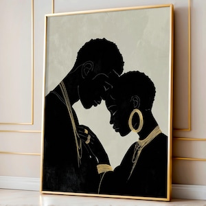 May include: A framed art print featuring a black silhouette of a couple in an embrace. The artwork has gold accents on jewelry and a neutral background. The frame is gold.