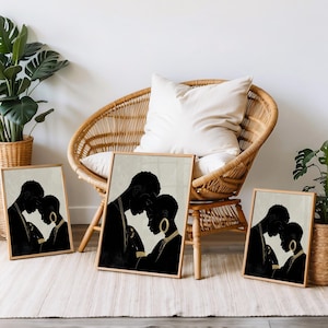 May include: Four framed art prints featuring black silhouettes of a couple embracing. The artwork has a neutral color palette with a beige background and wooden frames. The prints are displayed near a wicker chair and potted plants.