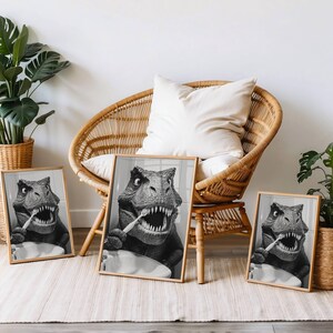 May include: Three black and white framed prints of a dinosaur brushing its teeth. The prints are hanging on a wall in a room with a wicker chair and a plant.