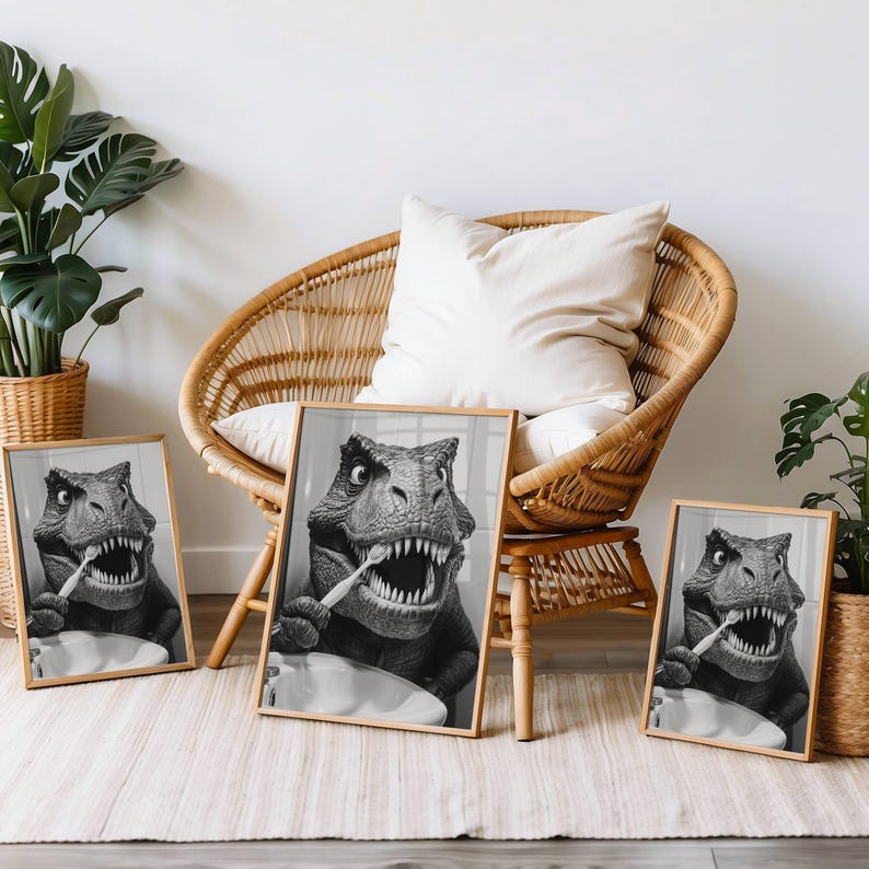 May include: Three black and white framed prints of a dinosaur brushing its teeth. The prints are hanging on a wall in a room with a wicker chair and a plant.