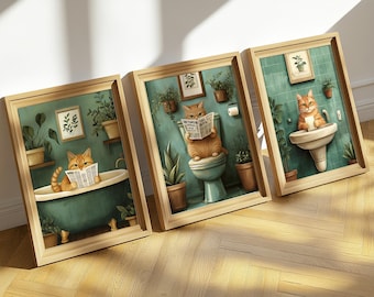 May include: Three framed illustrations of orange tabby cats in bathroom settings. The first cat is in a bathtub reading a newspaper. The second cat is on a toilet reading a newspaper. The third cat is washing its paws in a sink.