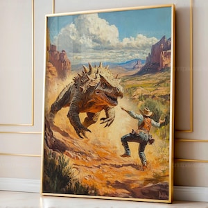 May include: A framed art print depicts a dinosaur chasing a cowboy in a desert landscape. The dinosaur is brown with spiky protrusions. The cowboy wears a hat, vest, and jeans. The background features mesas and a blue sky with clouds.