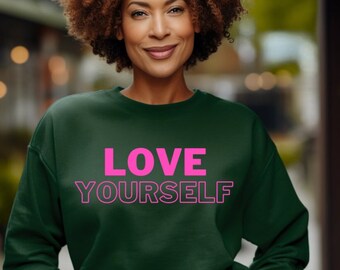 May include: A dark green sweatshirt with the text "LOVE YOURSELF" in pink.