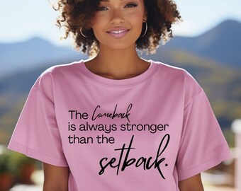 May include: A pink t-shirt with the text "The Comeback is always stronger than the setback." printed in black.