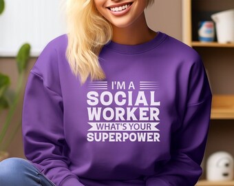 May include: A purple sweatshirt with the text "I'm a Social Worker What's Your Superpower" in white.