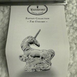 May include: Waterford Crystal Jewels Fantasy Collection - The Unicorn - A crystal figurine of a unicorn standing on a rock.