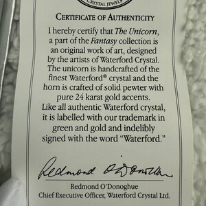 May include: A white certificate of authenticity for The Unicorn, part of the Fantasy collection, designed by the artists of Waterford Crystal. The certificate is signed by Redmond O'Donoghue, Chief Executive Officer, Waterford Crystal Ltd.