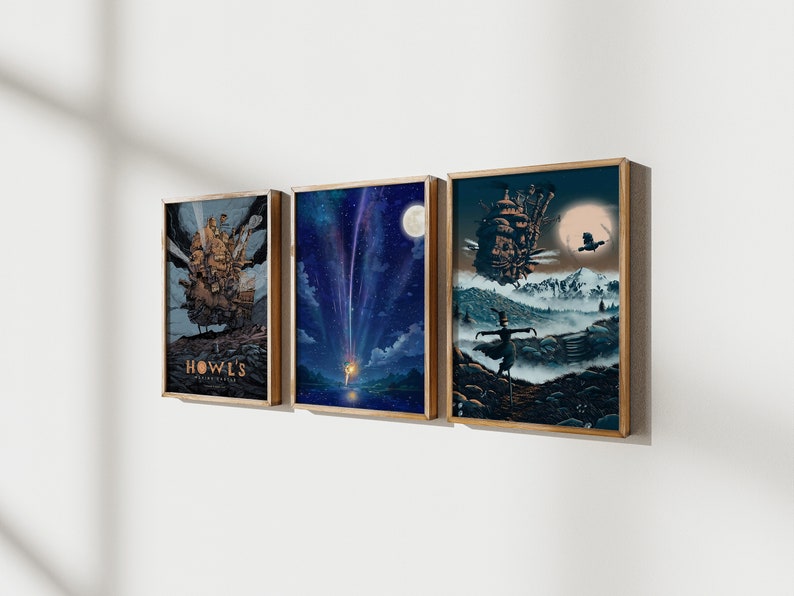May include: Three framed art prints featuring scenes from the animated film Howl's Moving Castle. The first print shows the castle flying through the air, the second print shows a shooting star in the night sky, and the third print shows a figure standing in a foggy landscape.