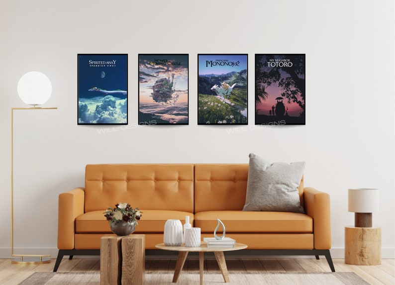 May include: Four framed art prints featuring scenes from animated films, including "Spirited Away," "Howl's Moving Castle," "Princess Mononoke," and "My Neighbor Totoro." The prints are displayed above an orange sofa in a living room setting.
