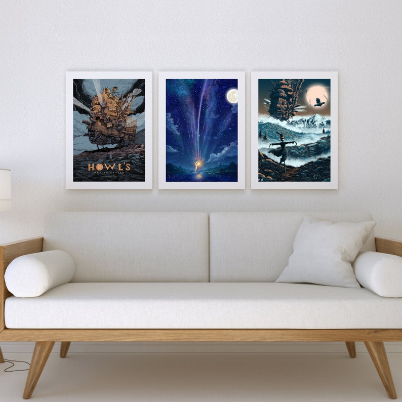 May include: Three framed prints of scenes from the animated film Howl's Moving Castle. The first print shows the moving castle in the sky, the second print shows a shooting star, and the third print shows a young woman standing in front of the castle.